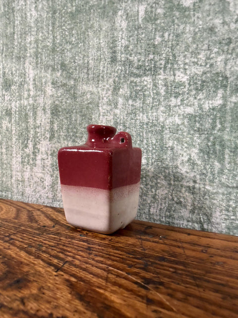 Small Two-Tone Ceramic Jug with Rich Red and Cream Glaze