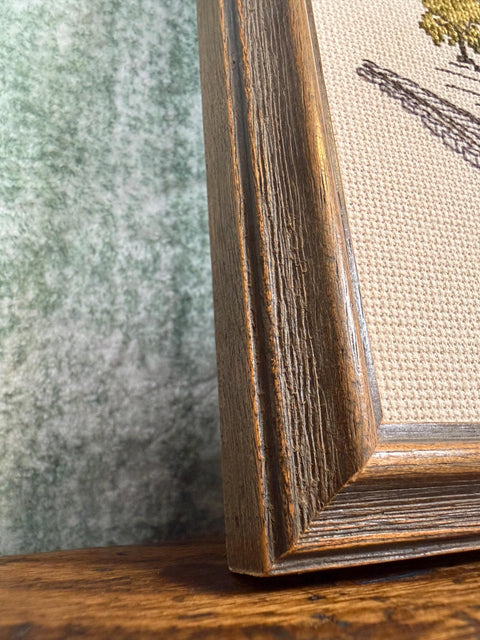 Framed Cross-Stitch Artwork Featuring a Charming Train Station Scene