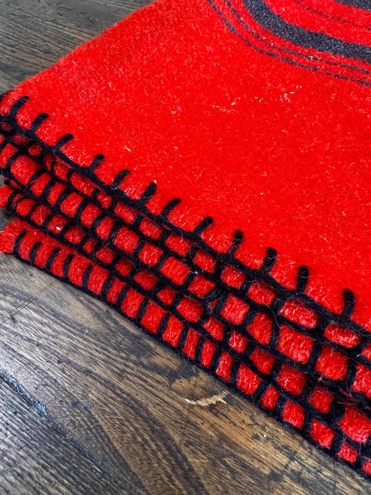 Red Wool Blanket with Black Stripes and Whipstitch Edging