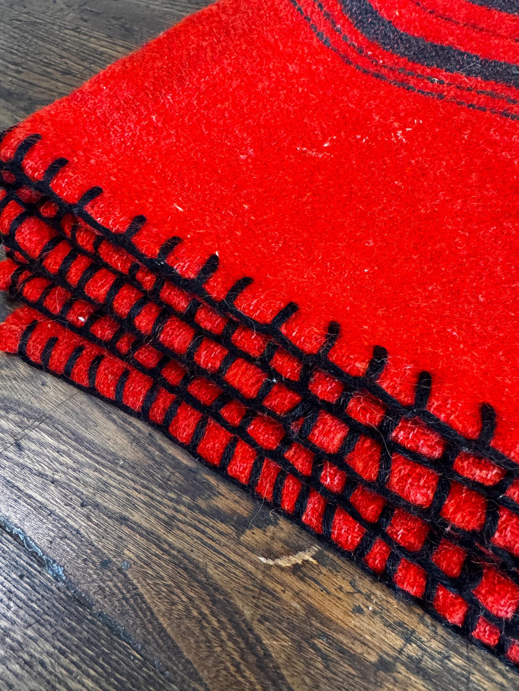 Red Wool Blanket with Black Stripes and Whipstitch Edging