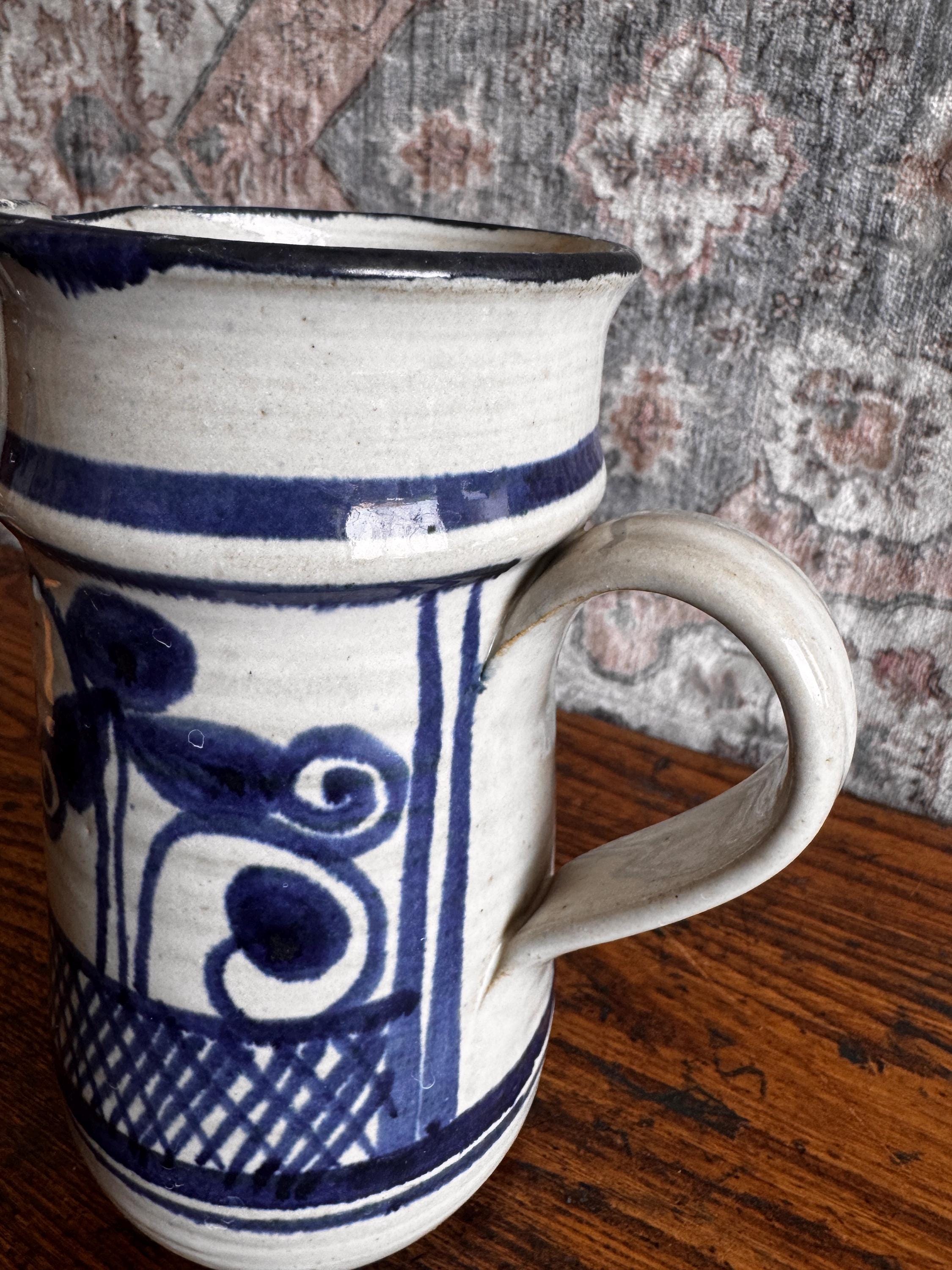 Hand-Painted Ceramic Pitcher with Blue Floral Design