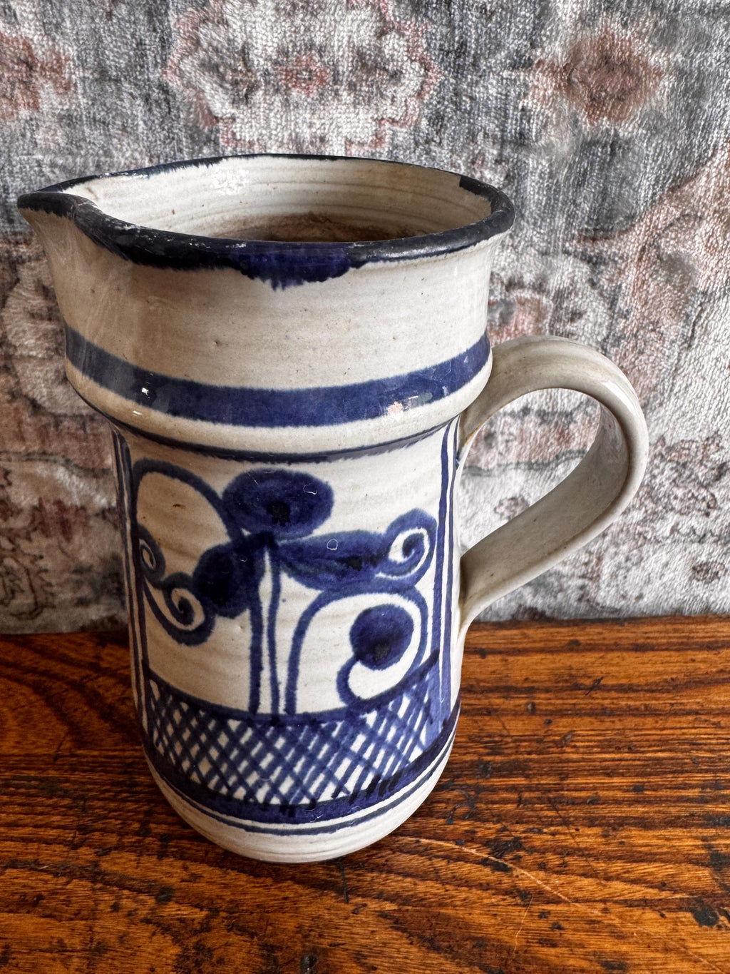 Hand-Painted Ceramic Pitcher with Blue Floral Design