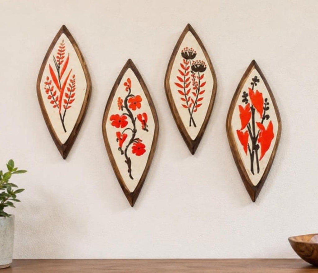 Set of Four Mid-Century Modern Syroco Wall Plaques with Floral Motifs