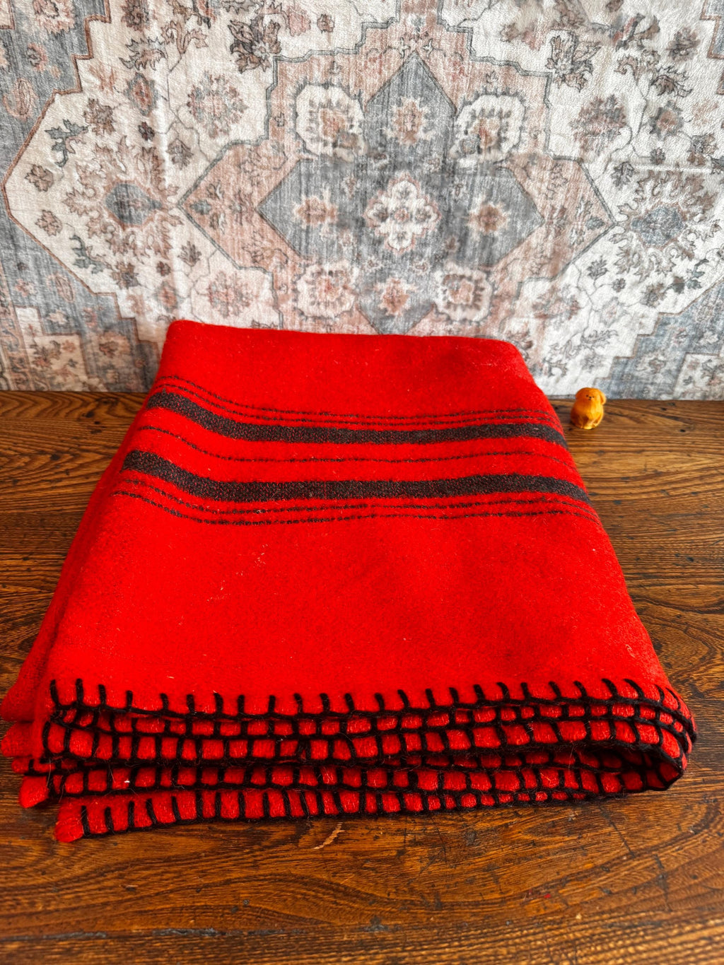 Red Wool Blanket with Black Stripes and Whipstitch Edging