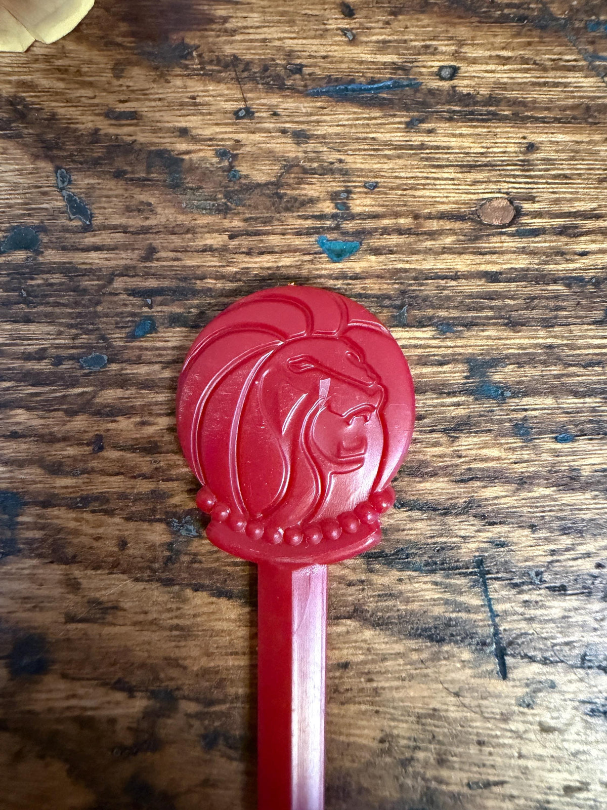 Vintage Red Plastic Swizzle Stick with Lion Head Design