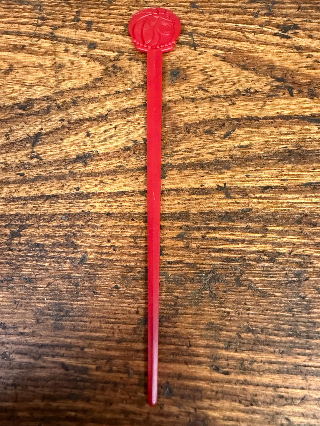 Vintage Red Plastic Swizzle Stick with Lion Head Design