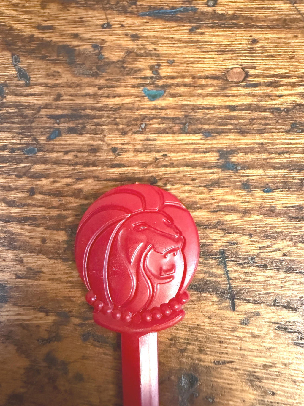 Vintage Red Plastic Swizzle Stick with Lion Head Design